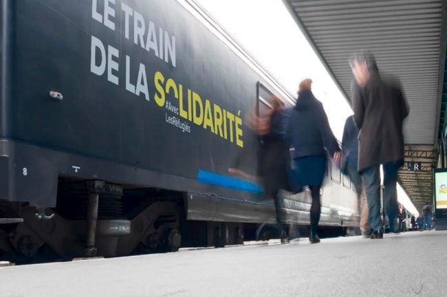 Covering train solidarité créé par l'Agence Oscar et Clémentine